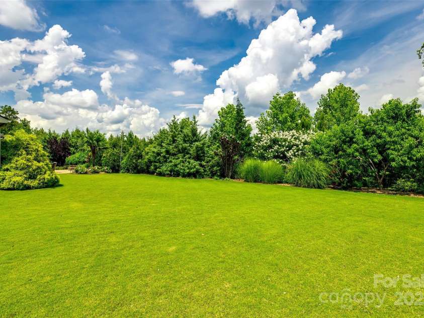 4220 Thames Circle, Fort Mill, SC 29715.  MLS# CAR4269866, YatesRealty ID 21352. Large, level lot with beautiful privacy and landscaping.
