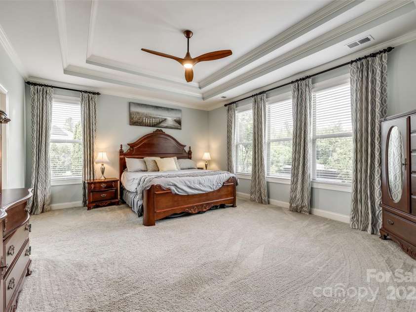 4220 Thames Circle, Fort Mill, SC 29715.  MLS# CAR4269866, YatesRealty ID 21352. Large primary bedroom with detailed ceilings.