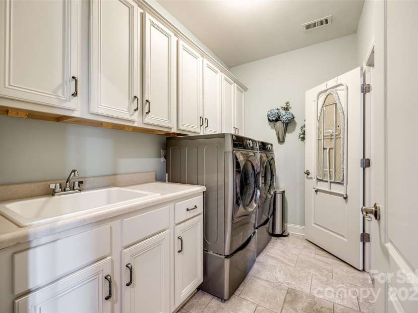 4220 Thames Circle, Fort Mill, SC 29715.  MLS# CAR4269866, YatesRealty ID 21352. The laundry room is spacious with plenty of stoarage.
