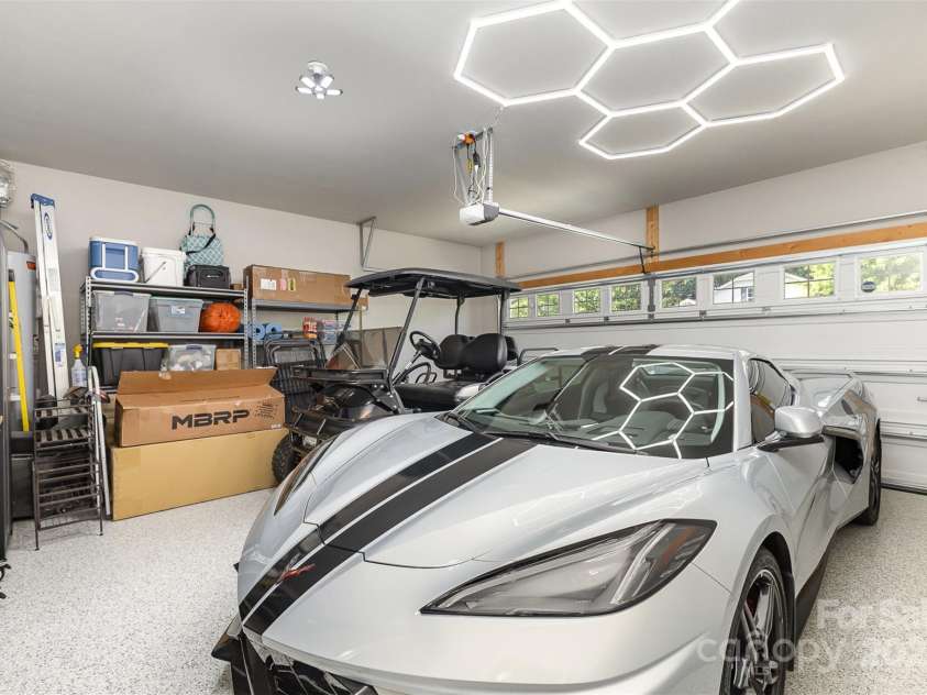 6007 Eleanor Rigby Road, Charlotte, NC 28278.  MLS# CAR4268118, YatesRealty ID 21354. Epoxy garage big enough for work bench, shelves, cars & golf carts
