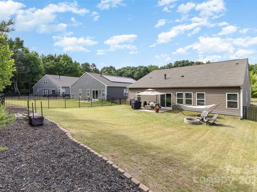 6007 Eleanor Rigby Road, Charlotte, NC 28278.  MLS# CAR4268118, YatesRealty ID 21354. Large, Level backyard with firepit
