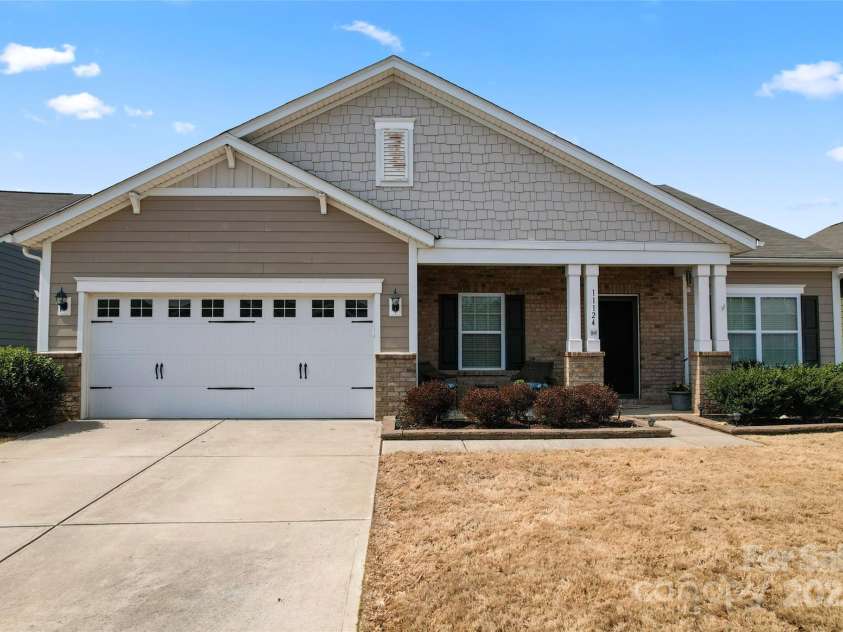11124 Chapeclane Road, Charlotte, NC 28278.  MLS# CAR4233516, YatesRealty ID 21362. 2 car garage and sidewalks