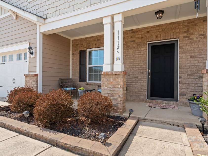 11124 Chapeclane Road, Charlotte, NC 28278.  MLS# CAR4233516, YatesRealty ID 21362. Cool covered Front porch