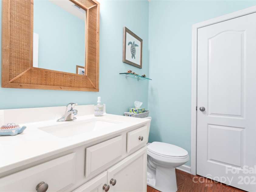 11124 Chapeclane Road, Charlotte, NC 28278.  MLS# CAR4233516, YatesRealty ID 21362. Half bath, linen closet and storage under vanity
