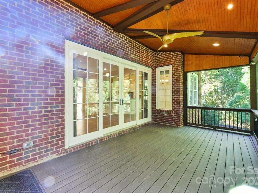 8928 Heydon Hall Circle, Charlotte, NC 28210.  MLS# CAR4297775, YatesRealty ID 21363. Enclosed screened in deck off of living room.