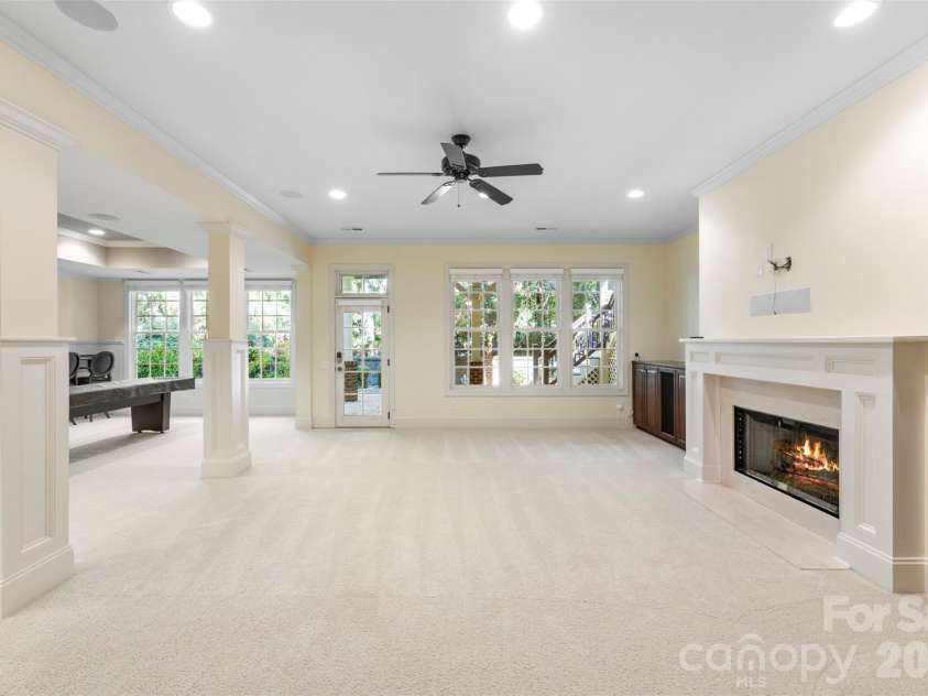 8928 Heydon Hall Circle, Charlotte, NC 28210.  MLS# CAR4297775, YatesRealty ID 21363. Full basement with gas fireplace and easy access to outside patio. 