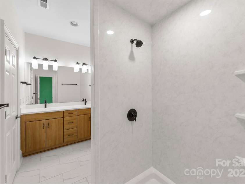 8928 Heydon Hall Circle, Charlotte, NC 28210.  MLS# CAR4297775, YatesRealty ID 21363. Renovated bath with custom glass on order