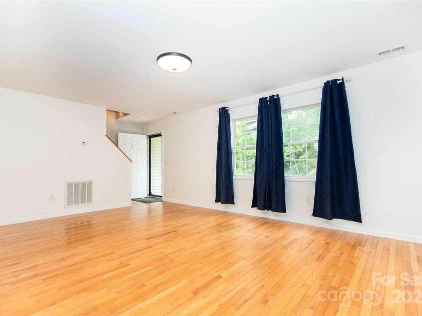 13 Castle Street, Asheville, NC 28803.  MLS# CAR4278006, YatesRealty ID 2138. Stairs to Upstairs, Front Door, and Living Room