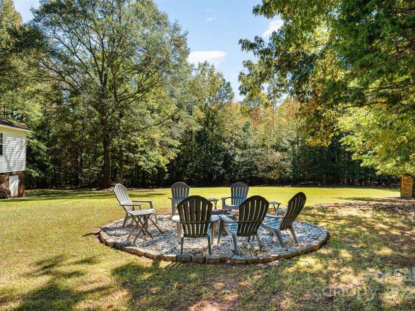 3220 Sawmill Road, Hickory Grove, SC 29717.  MLS# CAR4119221, YatesRealty ID 2138. Back View w/ Fire Pit