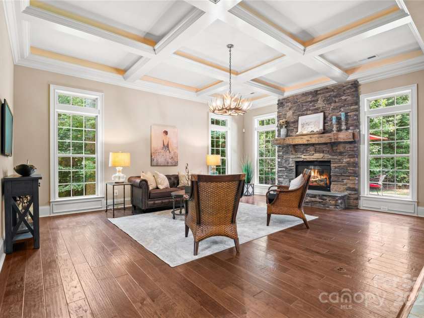 14130 Lea Point Court, Huntersville, NC 28078.  MLS# CAR4247240, YatesRealty ID 21385. Cozy family room with coffered ceiling with lights inside it for extra drama.