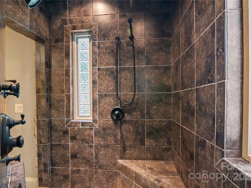 14130 Lea Point Court, Huntersville, NC 28078.  MLS# CAR4247240, YatesRealty ID 21385. Dramatic walk-through shower - it wraps around the bathtub.