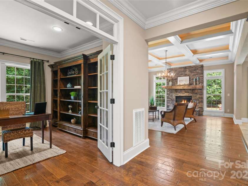 14130 Lea Point Court, Huntersville, NC 28078.  MLS# CAR4247240, YatesRealty ID 21385. Next to the living room is the fabulous office with a lovely shelving unit that conveys with the home.