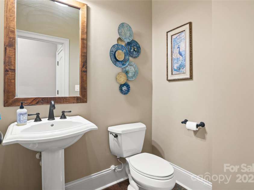 14130 Lea Point Court, Huntersville, NC 28078.  MLS# CAR4247240, YatesRealty ID 21385. Powder Room right off the garage.