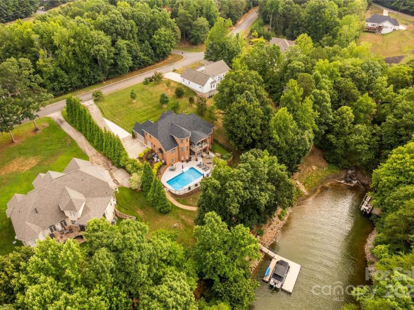 183 April Road, Troutman, NC 28166.  MLS# CAR4158487, YatesRealty ID 2139. Aerial View of Home and Lakefront