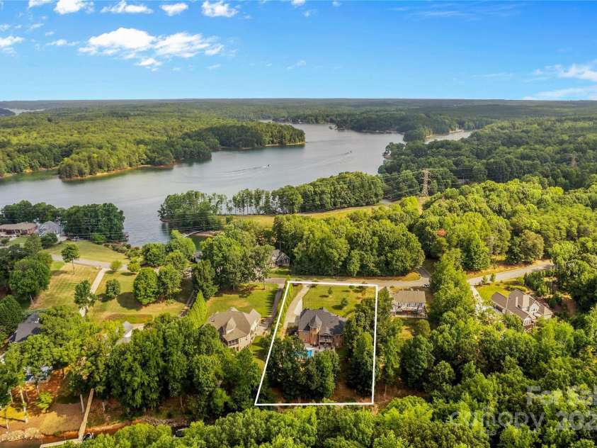 183 April Road, Troutman, NC 28166.  MLS# CAR4158487, YatesRealty ID 2139. Aerial View of Lush Trees on this Waterfront Lot