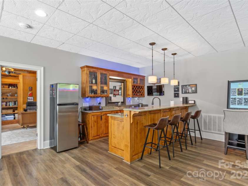 183 April Road, Troutman, NC 28166.  MLS# CAR4158487, YatesRealty ID 2139. Bar features a sink, Drink Cooler
