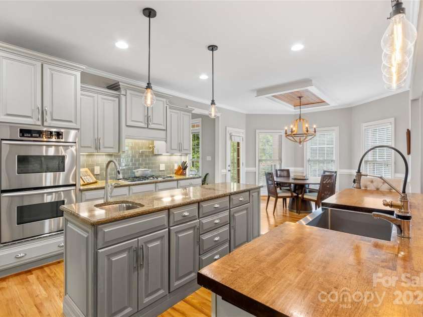 183 April Road, Troutman, NC 28166.  MLS# CAR4158487, YatesRealty ID 2139. Butcher Block Counters and Deep Farm Sink