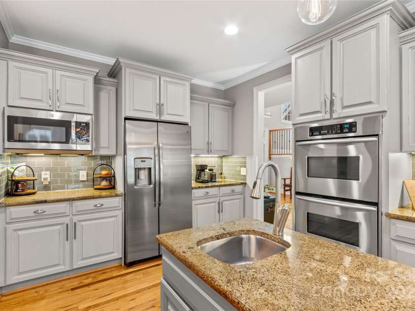 183 April Road, Troutman, NC 28166.  MLS# CAR4158487, YatesRealty ID 2139. Prep Sink at Kitchen Island; Double Ovens