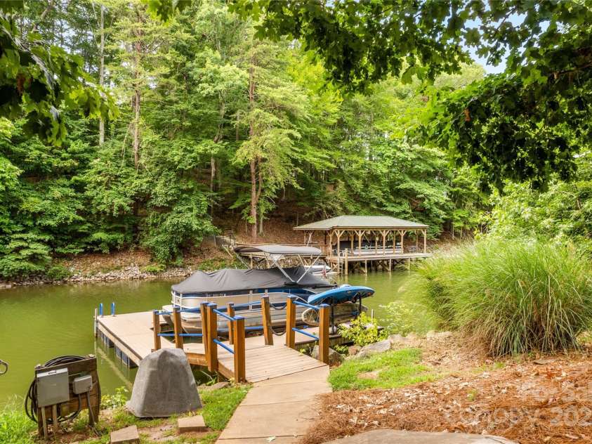 183 April Road, Troutman, NC 28166.  MLS# CAR4158487, YatesRealty ID 2139. Sidewalk leads to your Private Pier and Boat Slip