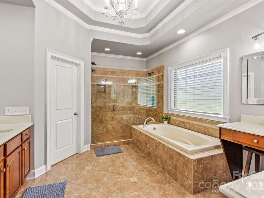 183 April Road, Troutman, NC 28166.  MLS# CAR4158487, YatesRealty ID 2139. The Primary Spa Bathroom; Whirlpool Soaking Tub, Shower