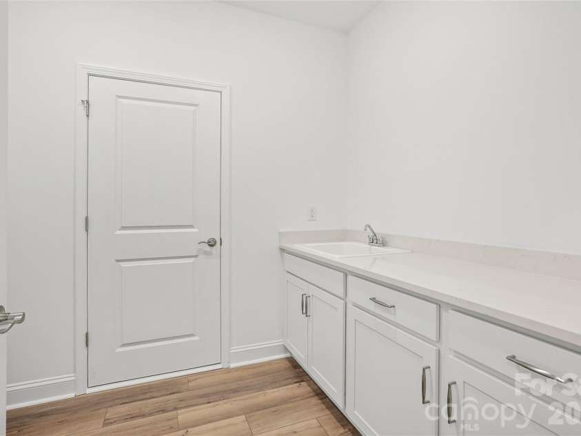 2730 Peak Court, Belmont, NC 28012.  MLS# CAR4381647, YatesRealty ID 21392. Convenient, large laundry room with cabinet/countertop/sink package