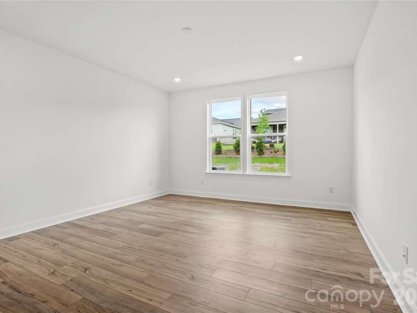 2730 Peak Court, Belmont, NC 28012.  MLS# CAR4381647, YatesRealty ID 21392. Large primary bedroom with continued EVP flooring