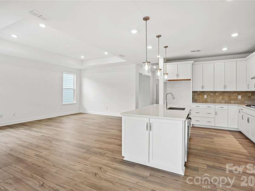 2730 Peak Court, Belmont, NC 28012.  MLS# CAR4381647, YatesRealty ID 21392. Perfect layout for entertaining.  Kitchen is open to gathering room with tray ceiling...