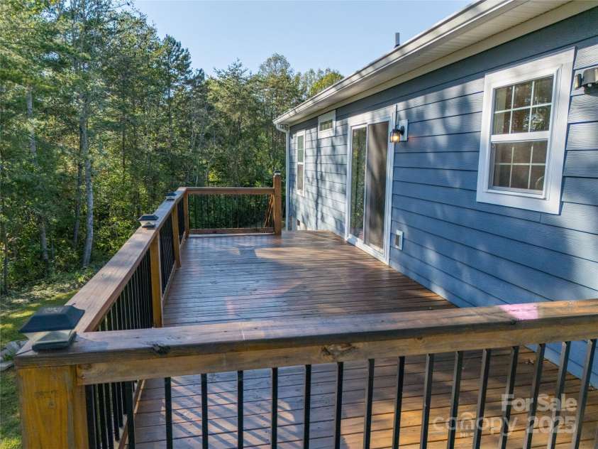 105 Bluebell Ridge Lane, Weaverville, NC 28787.  MLS# CAR4303351, YatesRealty ID 21393. Large deck off dining area for entertaining and and expanded outdoor living.