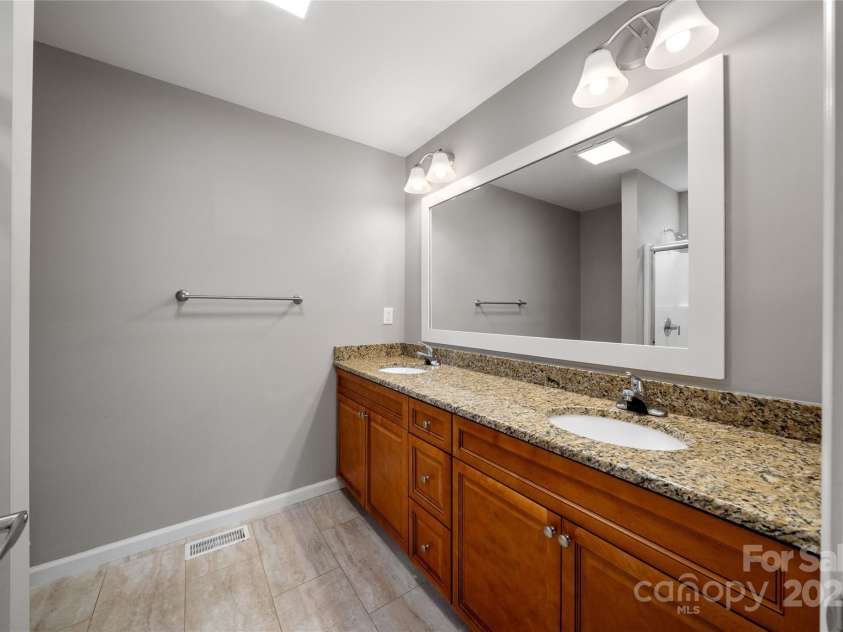 105 Bluebell Ridge Lane, Weaverville, NC 28787.  MLS# CAR4303351, YatesRealty ID 21393. Main bath with double sink, granite counters.