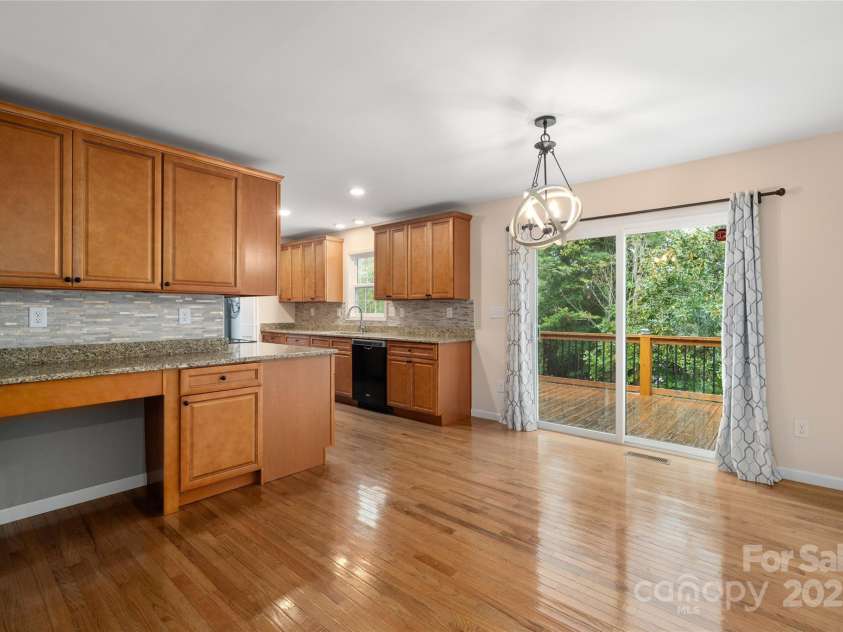 105 Bluebell Ridge Lane, Weaverville, NC 28787.  MLS# CAR4303351, YatesRealty ID 21393. Sliding doors off dining area lead to level backyard.