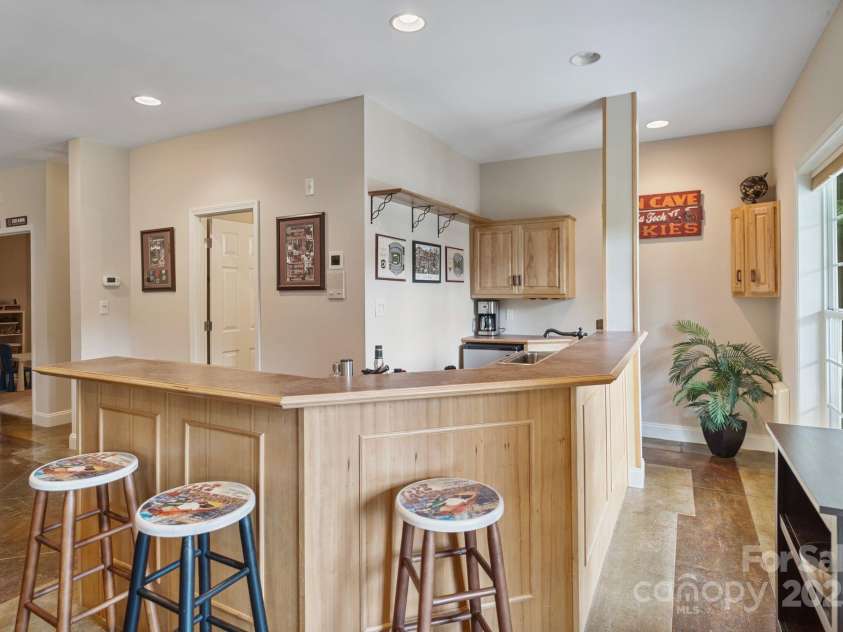 7471 Barfield Lane, Denver, NC 28037.  MLS# CAR4250519, YatesRealty ID 21396. Basement wet-bar offering ease while entertaining guests.