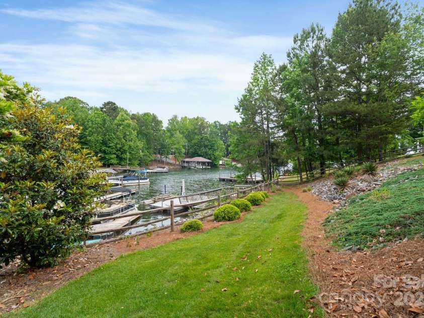 7471 Barfield Lane, Denver, NC 28037.  MLS# CAR4250519, YatesRealty ID 21396. Experience the relaxing lake lifestyle! Quiet cove is calm and perfect for paddle boarding, swimming, and fishing