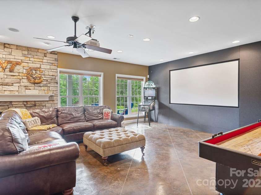 7471 Barfield Lane, Denver, NC 28037.  MLS# CAR4250519, YatesRealty ID 21396. Full media set up with built in screen and projector.