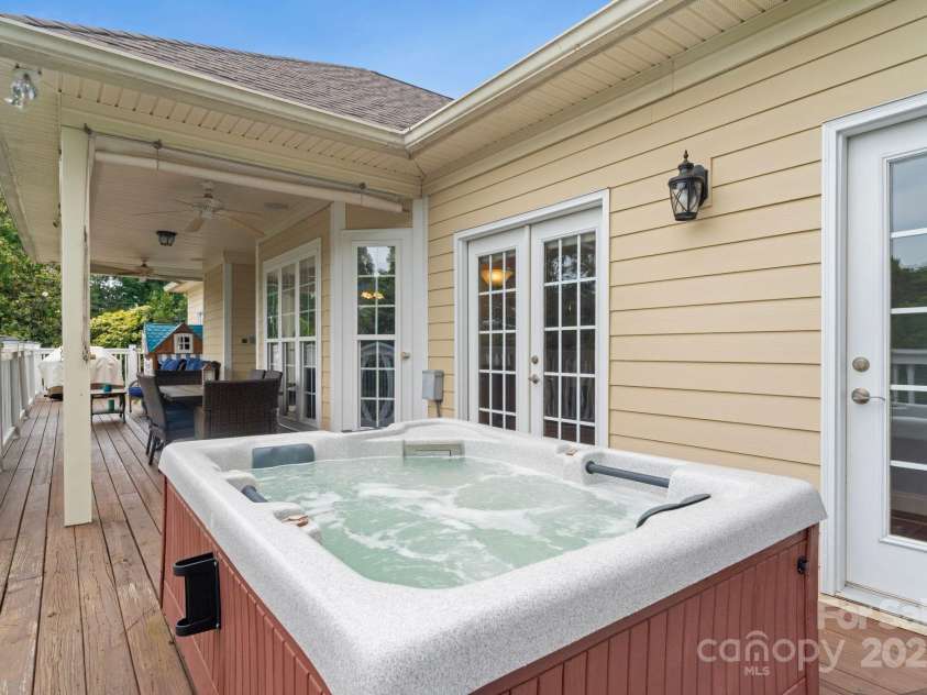 7471 Barfield Lane, Denver, NC 28037.  MLS# CAR4250519, YatesRealty ID 21396. Hot tub on extended rear deck with easy access from primary bedroom