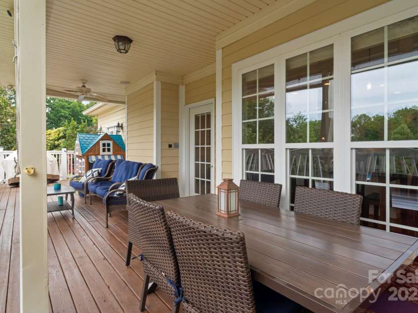 7471 Barfield Lane, Denver, NC 28037.  MLS# CAR4250519, YatesRealty ID 21396. Main level partially covered back deck.