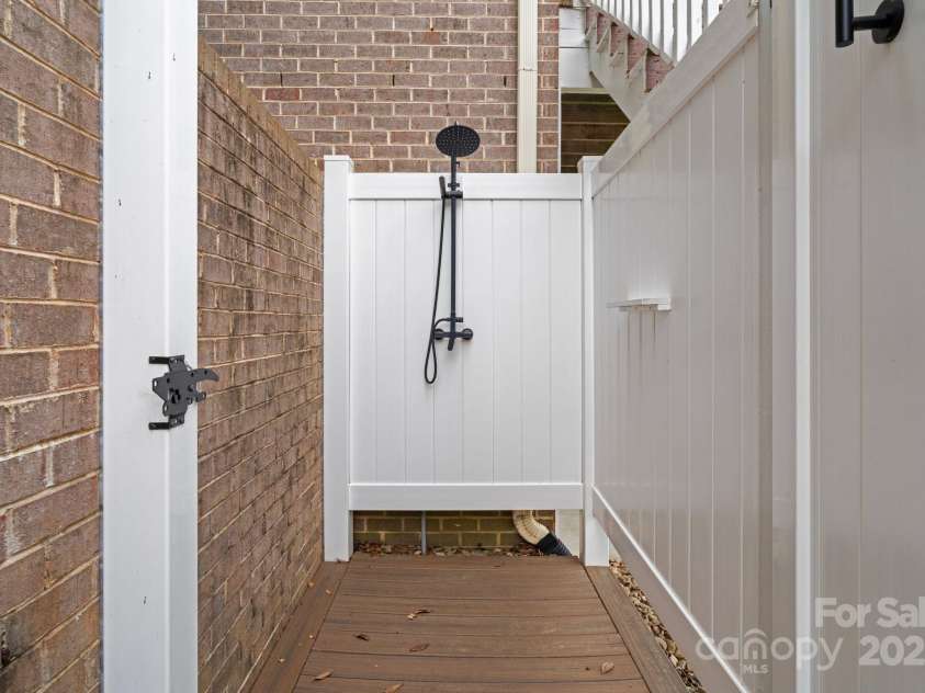 7471 Barfield Lane, Denver, NC 28037.  MLS# CAR4250519, YatesRealty ID 21396. Outdoor shower adds a huge bonus for a rinse off after spending the day in the lake.