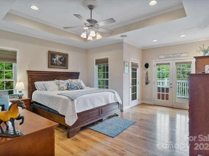 7471 Barfield Lane, Denver, NC 28037.  MLS# CAR4250519, YatesRealty ID 21396. Primary bedroom is a private retreat with direct access to the deck and hot tub!