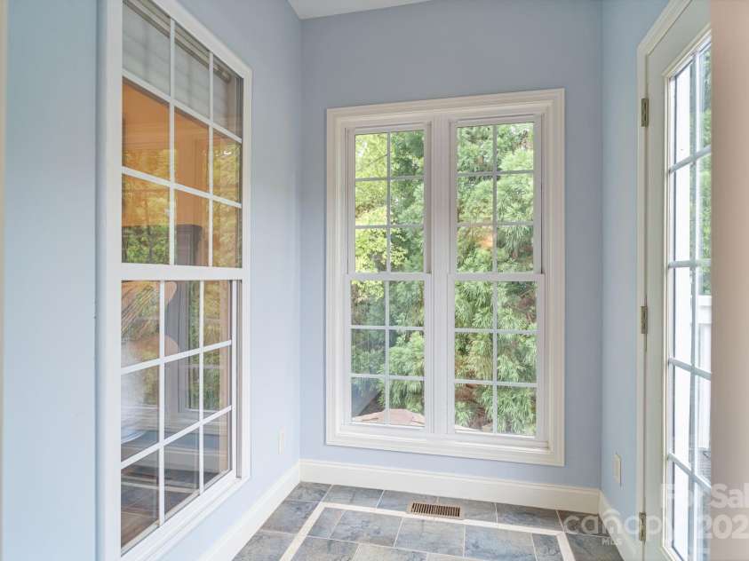 7471 Barfield Lane, Denver, NC 28037.  MLS# CAR4250519, YatesRealty ID 21396. Versatile room off primary with abundant natural light-great for plants!