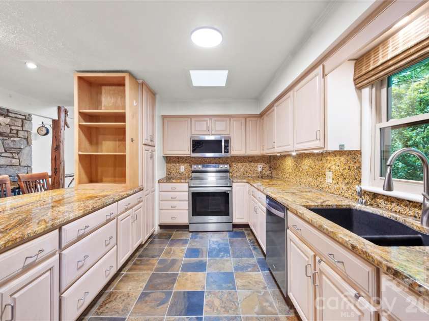 1483 Old Fort Road, Fairview, NC 28730.  MLS# CAR4376966, YatesRealty ID 21397. Sky lights in kitchen