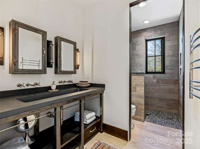 18 Wolfe Cove Road, Asheville, NC 28804.  MLS# CAR4231341, YatesRealty ID 21400. Shared upstairs bathroom equipped with heated floors and towel warmer for complete comfort.