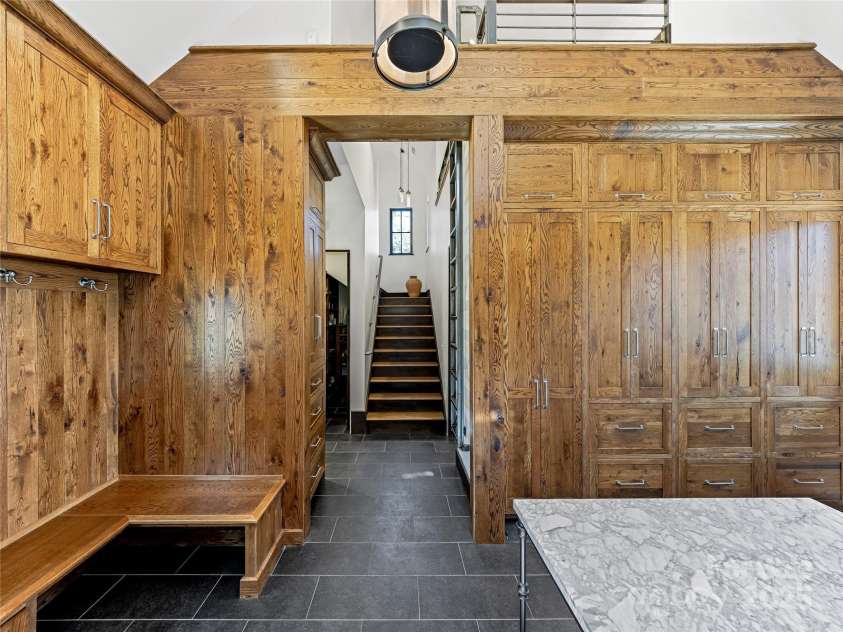 18 Wolfe Cove Road, Asheville, NC 28804.  MLS# CAR4231341, YatesRealty ID 21400. Step inside the 2nd front entrance to the home into the mud/laundry room.