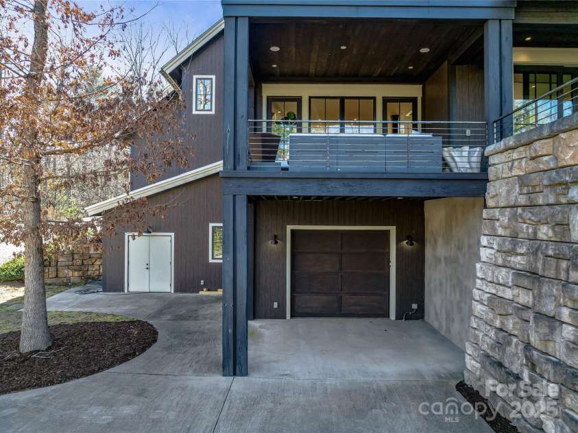 18 Wolfe Cove Road, Asheville, NC 28804.  MLS# CAR4231341, YatesRealty ID 21400. Tandem garage access in rear of home.