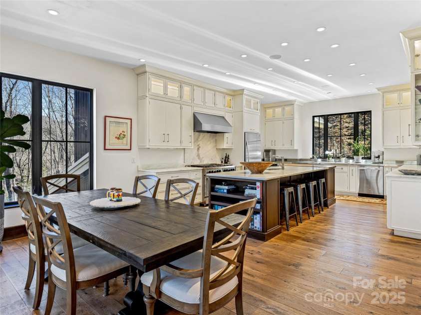 18 Wolfe Cove Road, Asheville, NC 28804.  MLS# CAR4231341, YatesRealty ID 21400. The chef's kitchen and dining area make preparing and serving meals a breeze.