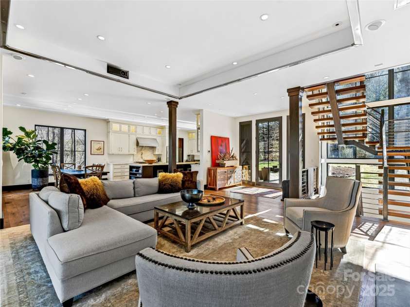 18 Wolfe Cove Road, Asheville, NC 28804.  MLS# CAR4231341, YatesRealty ID 21400. The high ceilings and extensive windows throughout create such a light and bright living space.