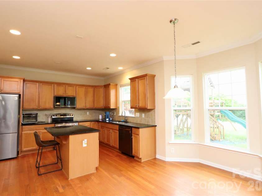 3586 Larkhaven Avenue, Concord, NC 28027.  MLS# CAR4398319, YatesRealty ID 21400. Breakfast nook area in kitchen.