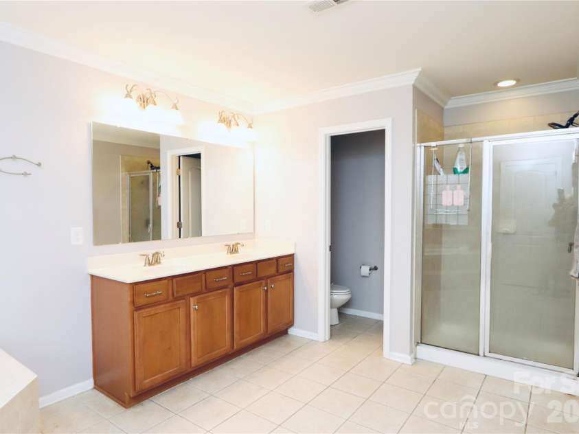 3586 Larkhaven Avenue, Concord, NC 28027.  MLS# CAR4398319, YatesRealty ID 21400. Dual vanity and water closet
