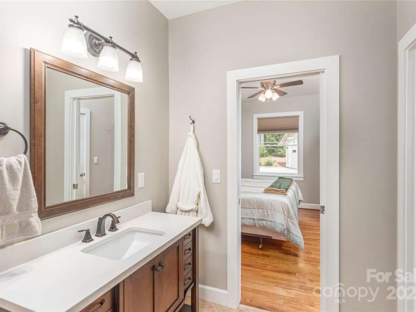 930 Big Raven Lane, Saluda, NC 28773.  MLS# CAR4270163, YatesRealty ID 21407. A jack and jill, full bath with shower, connects the 2 bedrooms