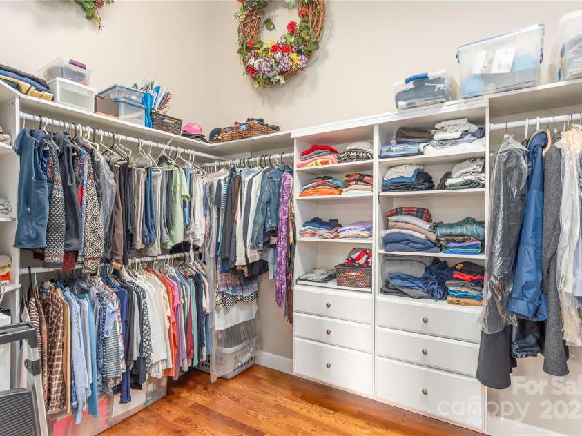 930 Big Raven Lane, Saluda, NC 28773.  MLS# CAR4270163, YatesRealty ID 21407. Built-ins make this walk in closet a dream come true