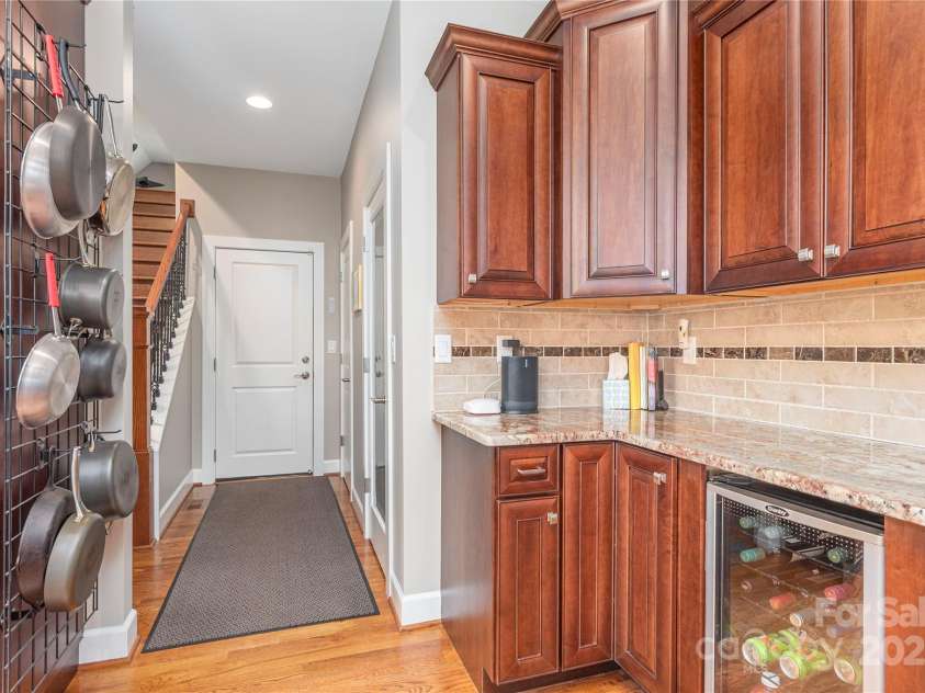 930 Big Raven Lane, Saluda, NC 28773.  MLS# CAR4270163, YatesRealty ID 21407. Plenty of storage with a wet bar, wine fridge, and walk in pantry