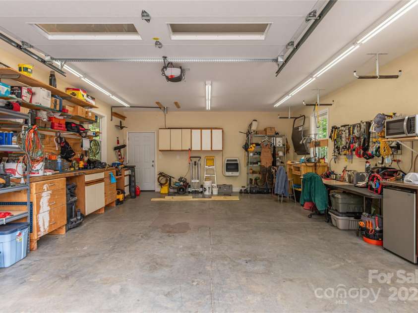 930 Big Raven Lane, Saluda, NC 28773.  MLS# CAR4270163, YatesRealty ID 21407. This workshop garage has extra storage & power